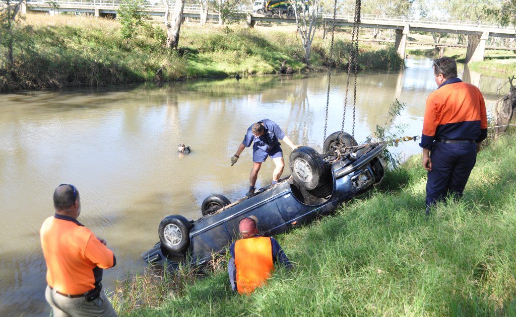 Warwick Tilt Tray Towing and Bellingham's Crane Hire along with diver Pat Windle worked to retrieve the navy blue Bentley from the river near McCahon Bridge. Photo Georja Ryan / Warwick Daily News Warwick Tilt Tray Towing and Bellingham's Crane Hire along with diver Pat Windle worked to retrieve the navy blue Bentley from the river near McCahon Bridge. Photo Georja Ryan / Warwick Daily News